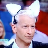 Anderson Cooper wearing a pair of robotic cat ears